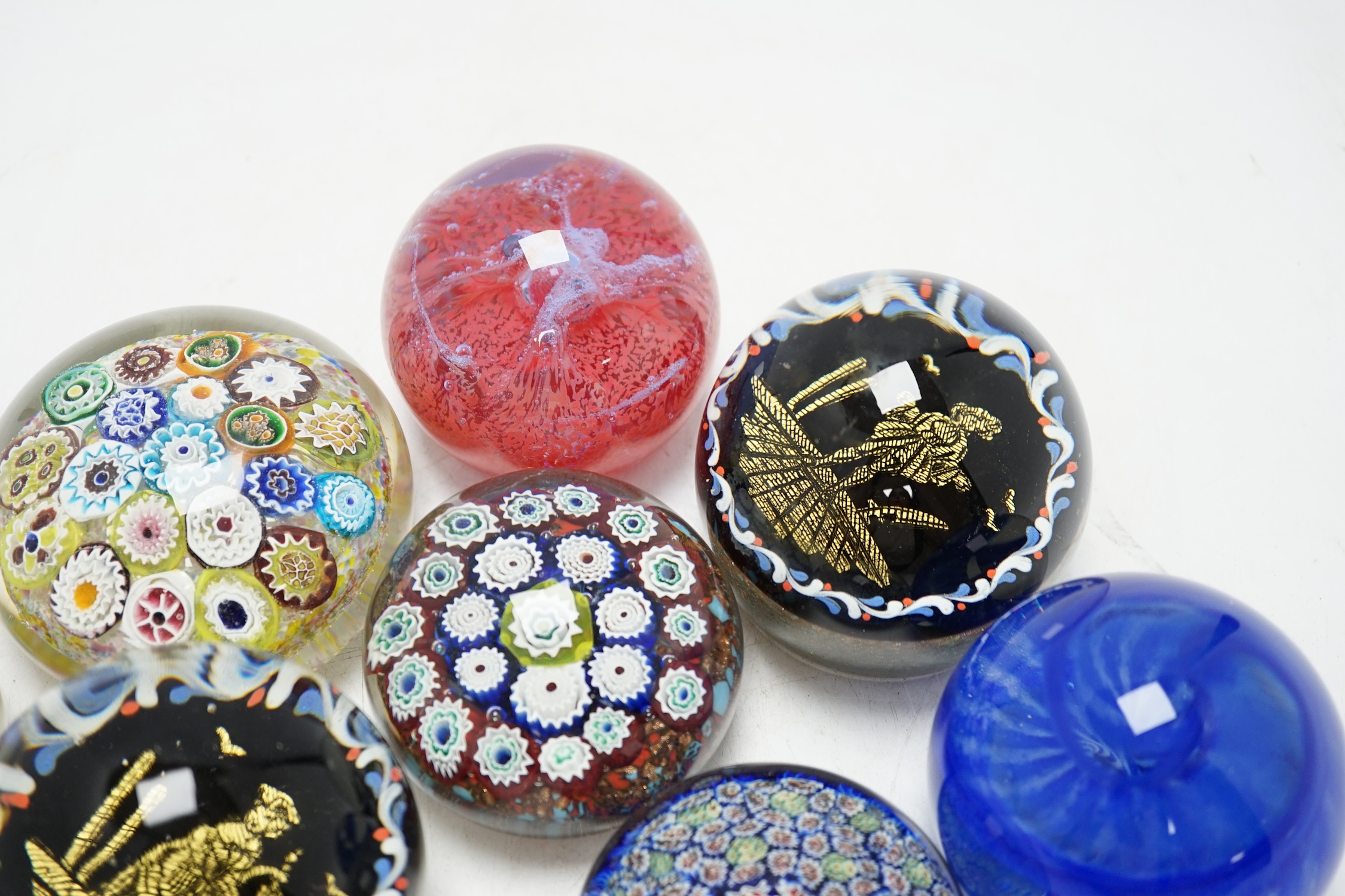 A group of eight various glass paperweights including millefiori, tallest 8cm. Condition - varies, poor to fair